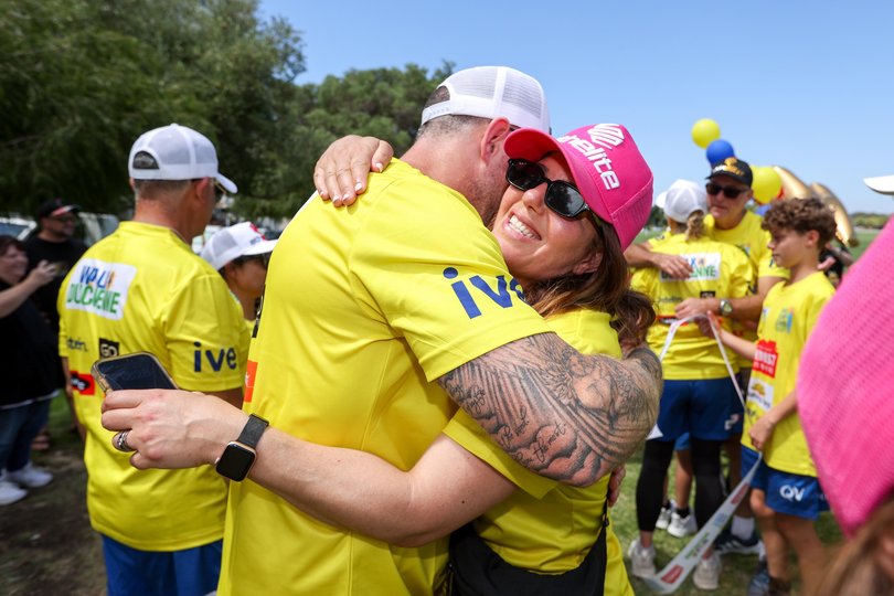 The Save our Sons charity walk concludes at Langley Park, Perth, on Sunday. Pictured are participants at the finish line. Picture: Carwyn Monck