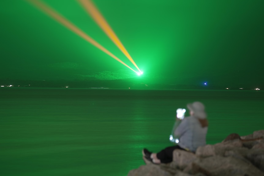 a woman taking a photo 