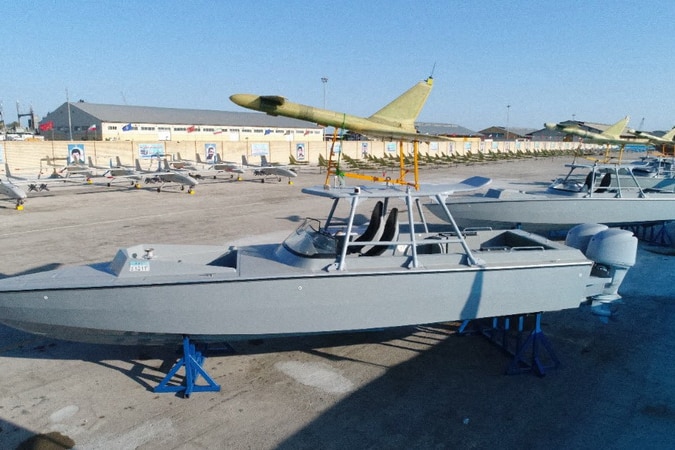 A close up of a speed boats yellow plane.