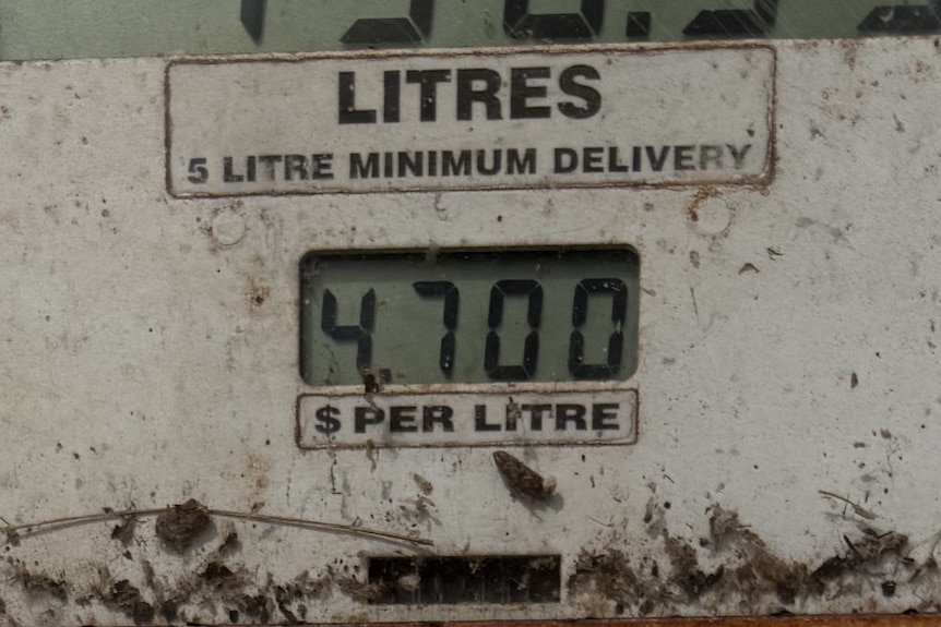 A white fuel pump displaying the price of aviation fuel.