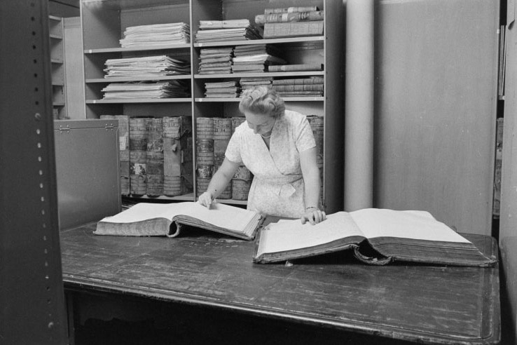 black and white photo of Margaret Medcalf in the archives in 1969