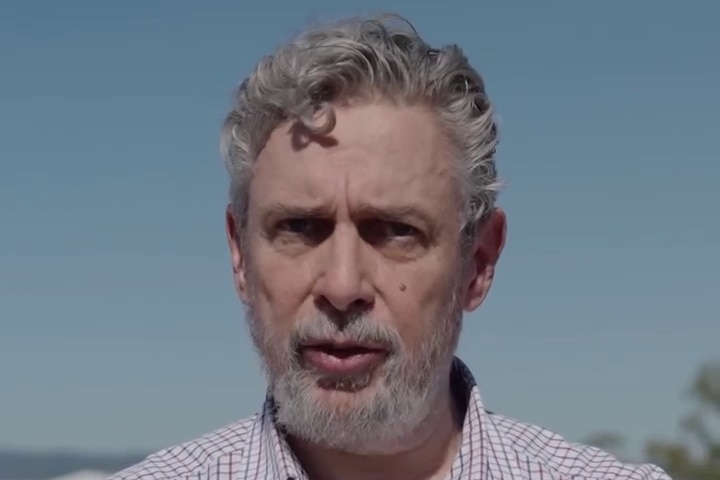 A man in a checked shirt 