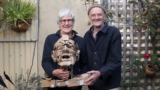 Rod Holdaway (left) holds a bust he created of Merrick Fry.