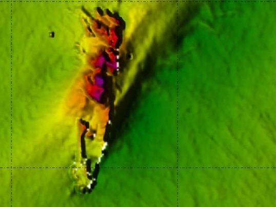 A colourful thermal image showing a wreckage shape under the seabed.