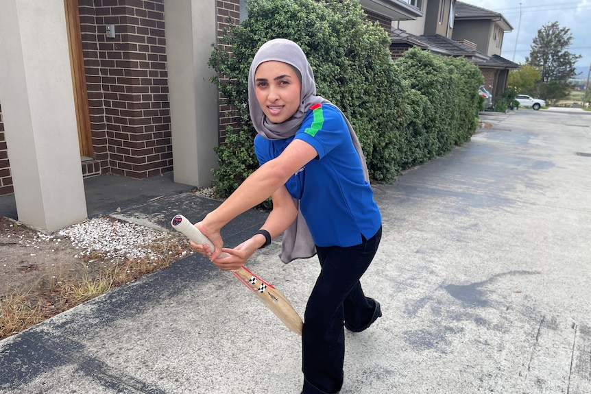 Firooza posing with bat