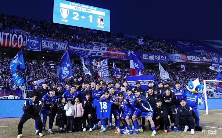 Suwon Samsung Bluewings players and coaches pose after their K League 2 2026 Round 1 season opener against Seoul E-Land at Suwon World Cup Stadium in Suwon, Gyeonggi Province, Feb. 28. Courtesy of Suwon Samsung Bluewings