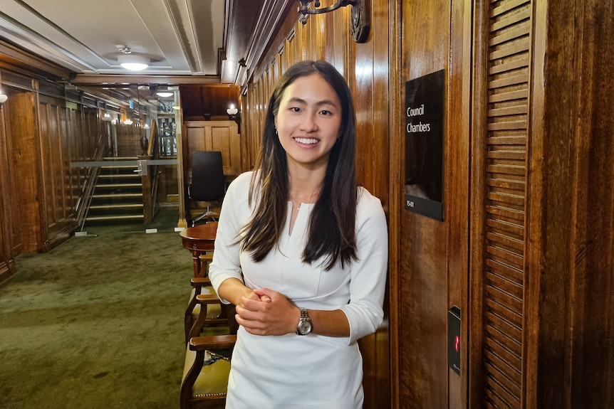 An asian woman in a hallway