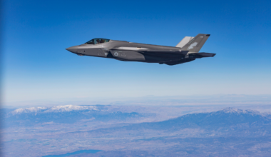 One of Australia’s first two F-35A aircraft A35-009_Lockheed Martin in flight over a rugged landscape