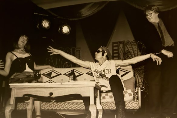 Linda Gibson, left, shocked by Rich Hall being handcuffed to Sue-Ann Post.