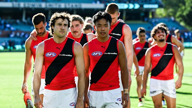 Andrew McGrath of the Bombers leads his team off after the loss to Port.