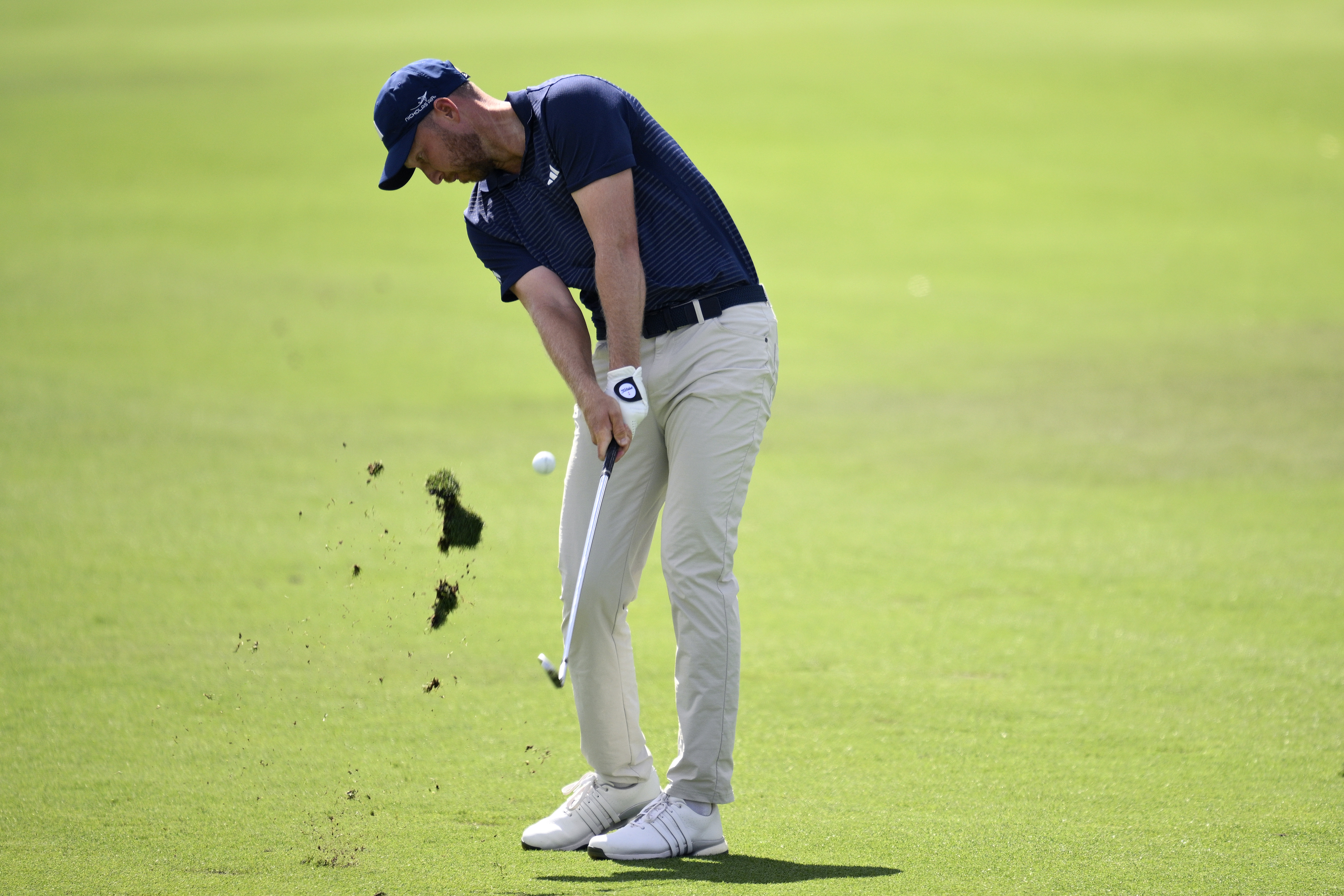 Daniel Berger hits an iron shot