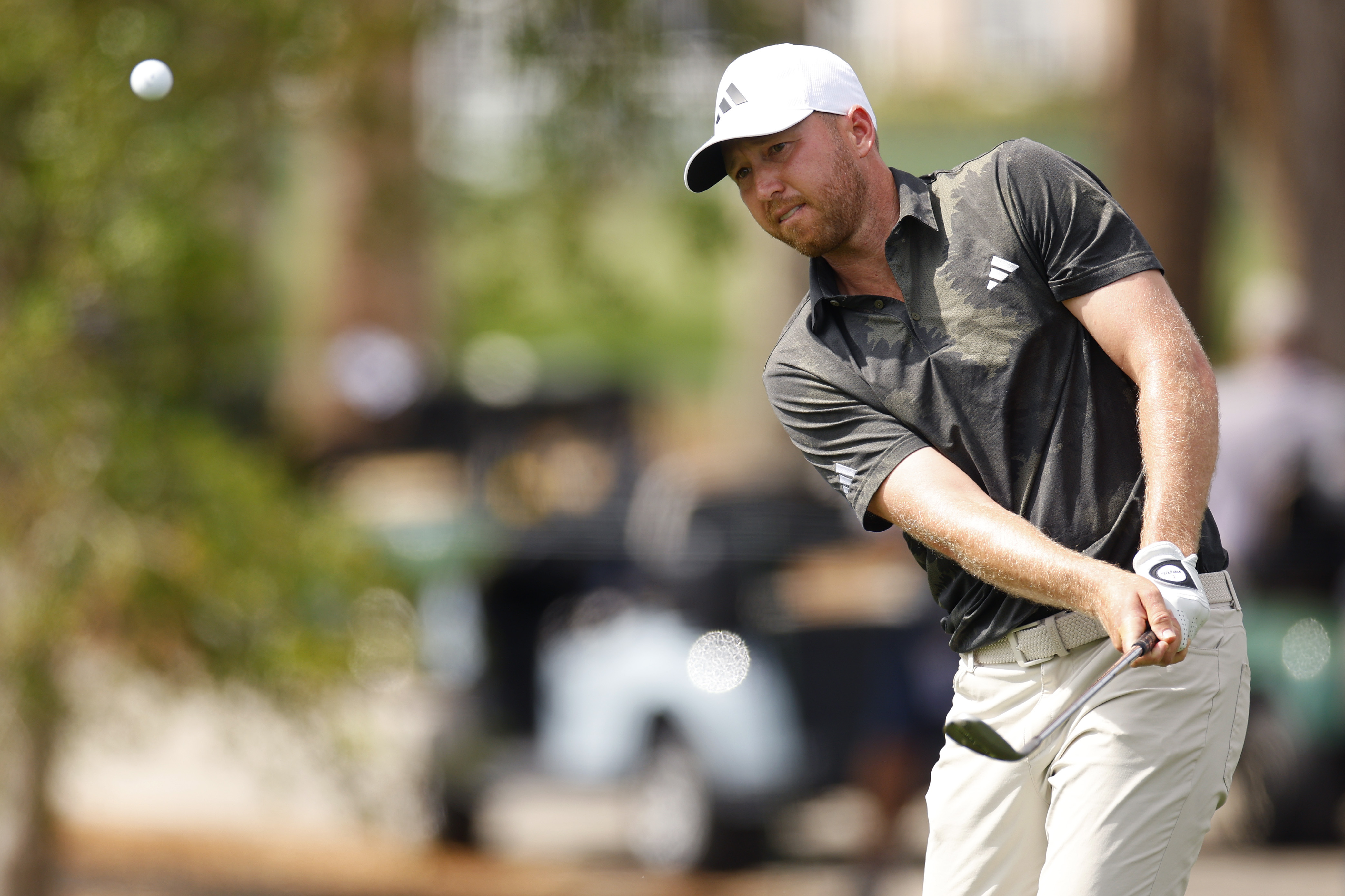Daniel Berger hits a chip shot