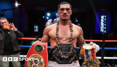 Jai Opetaia holds his IBF, Ring belts with the Zuffa Boxing belt around his waist