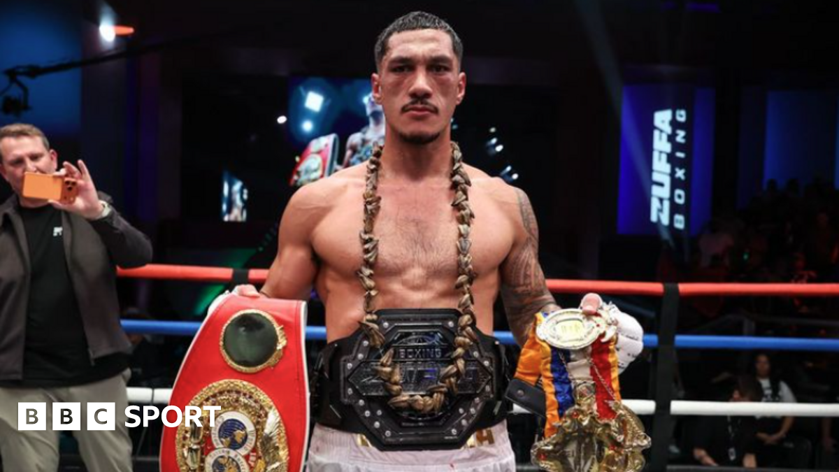 Jai Opetaia holds his IBF, Ring belts with the Zuffa Boxing belt around his waist