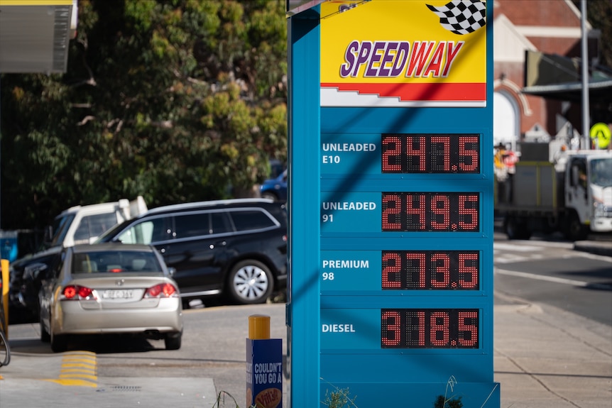 A price board displaying petrol for more than $2.47 per litre.