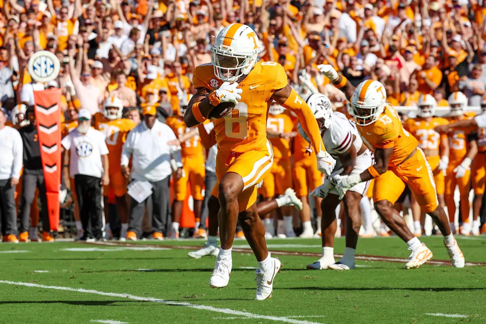 Sep 27, 2025; Starkville, Mississippi, USA; Tennessee Volunteers defensive back Colton Hood (8) runs with the ball after an interception against the Mississippi State Bulldogs during the first half at Davis Wade Stadium at Scott Field. Mandatory Credit: Wesley Hale-Imagn Images