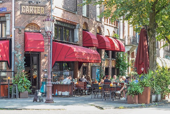 Al fresco diners enjoy the atmosphere at a restaurant in the trendy neighbourhood of Amsterdam.