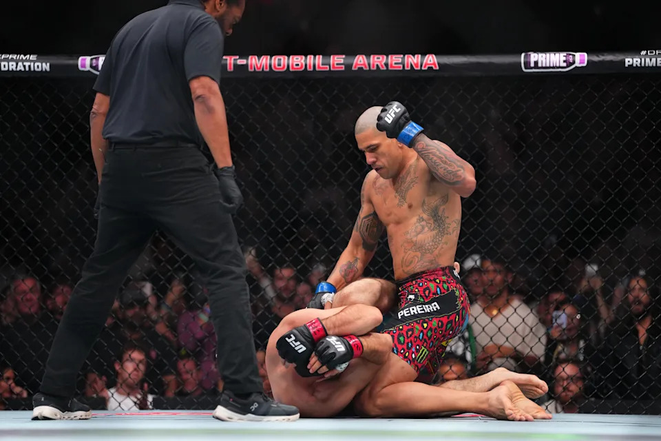 LAS VEGAS, NEVADA - OCTOBER 04:  (R-L) Alex Pereira of Brazil punches Magomed Ankalaev of Russia in their light heavyweight title fight at T-Mobile Arena on October 04, 2025 in Las Vegas, Nevada. (Photo by Cooper Neill/Zuffa LLC)