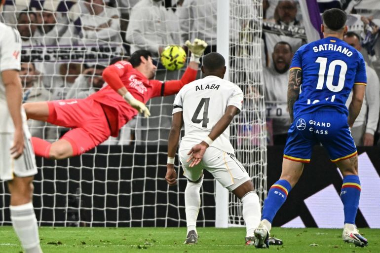 Getafe's Uruguayan forward #10 Martín Satriano scores the opening goal during the Spanish league football match between Real Madrid CF and Getafe CF at Santiago Bernabeu Stadium in Madrid on March 2, 2026. (Photo by Javier SORIANO / AFP)