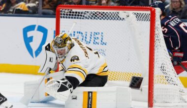 Bruins goalie Jeremy Swayman covers up the puck during the first period of Sunday's showdown against the Blue Jackets in Columbus, Ohio.
