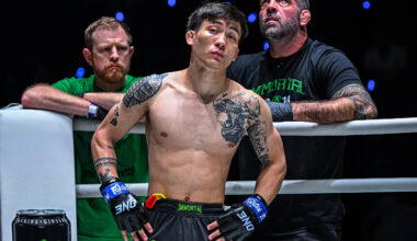 MMA fighter Joshua Perreira stands in the ring corner with Matt Browb behind him