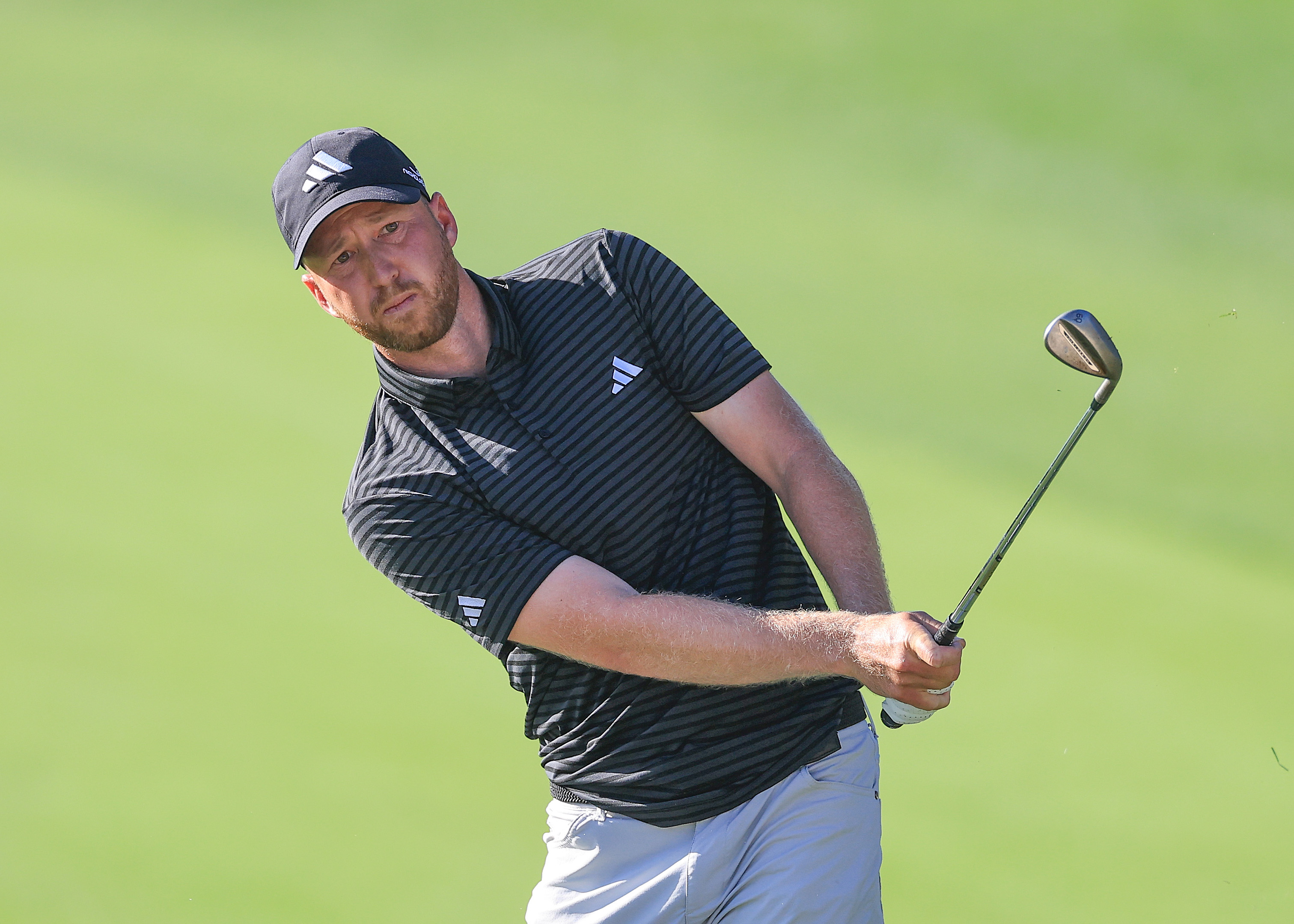 Daniel Berger hits a wedge shot