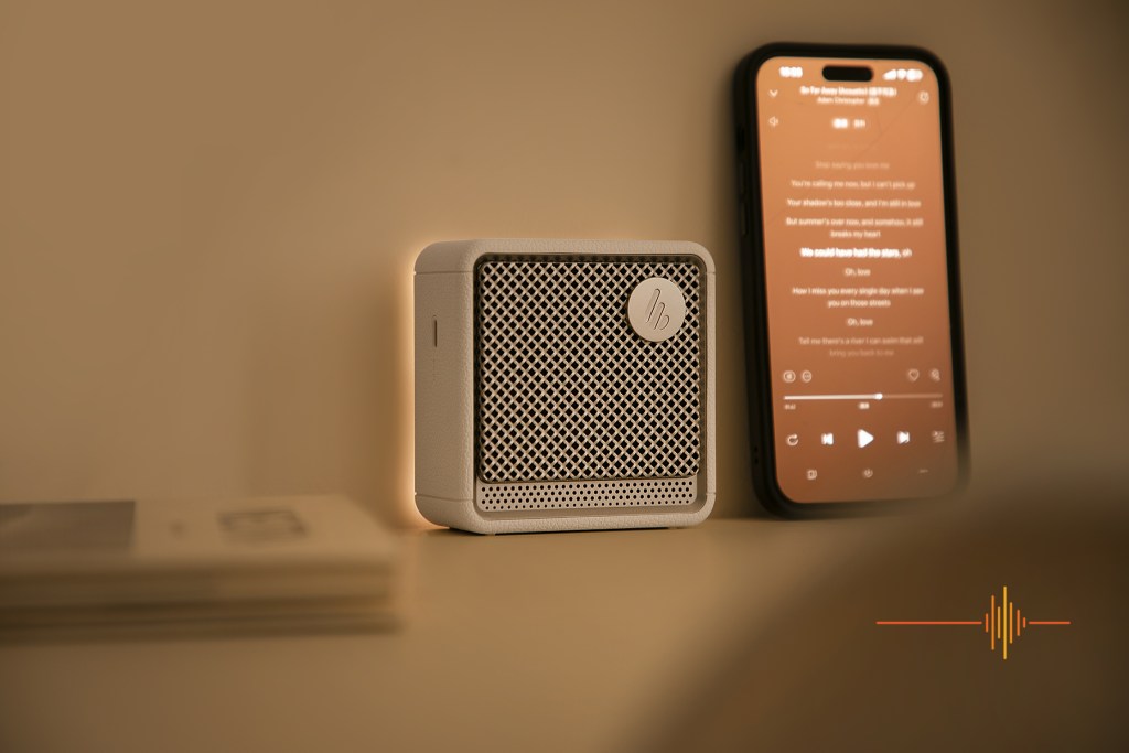 ES20 Portable Bluetooth Speaker next to iPhone