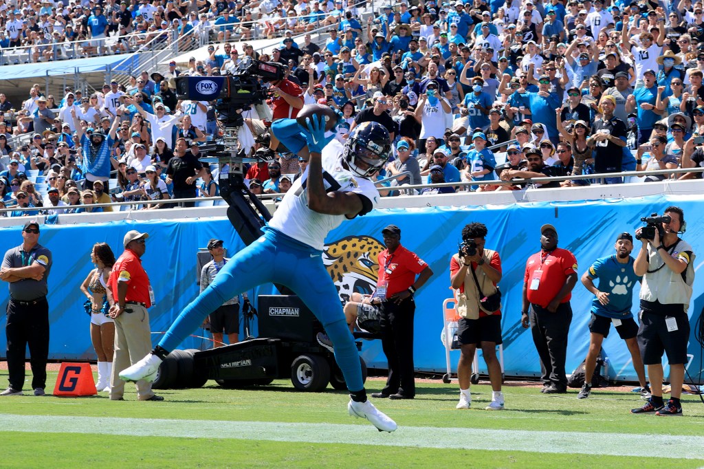 D.J. Chark makes a reception for a touchdown during the game against the Arizona Cardinals at TIAA Bank Field on September 26, 2021 in Jacksonville, Florida.