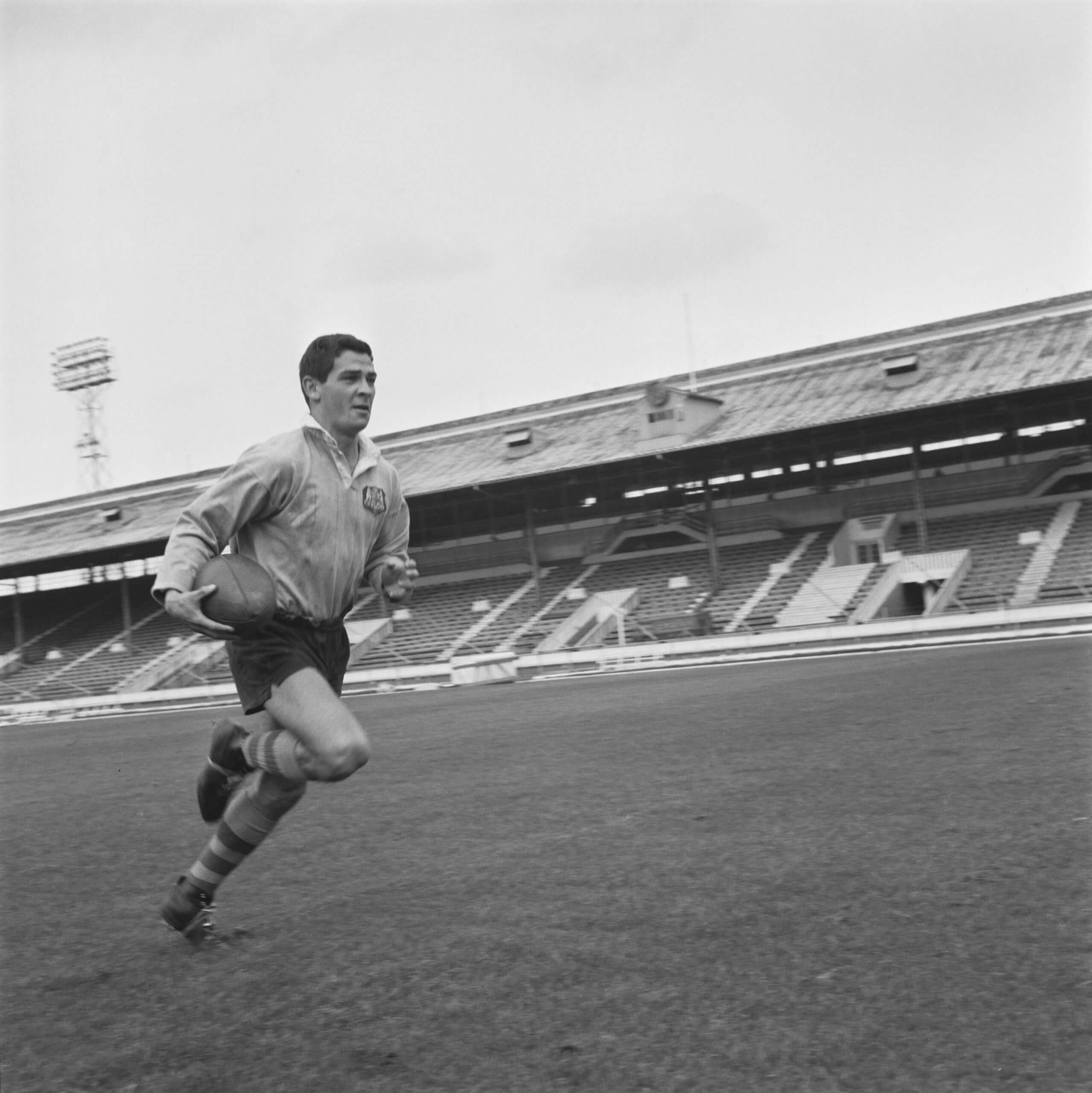 Ken Irvine running with the ball at White City Stadium in 1963-64