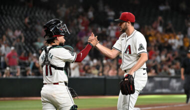 Jose Herrera #11 and Ryan Thompson #81 of the Arizona Diamondbacks celebrate a 5-4 win against the ...