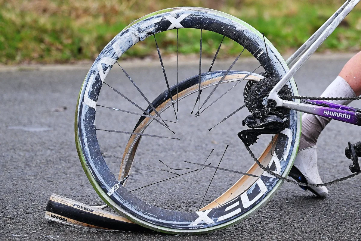 NIVONE, BELGIUM - FEBRUARY 28: Detail of the exploded tire of Amaury Capiot of Belgium and Team Jayco AlUla during the 21st Omloop Het Nieuwsblad 2026, Men's Elite a 207.2km one day race from Ghent to Ninove / #UCIWT / on February 28, 2026 in Ninove, Belgium. (Photo by Tim de Waele/Getty Images)