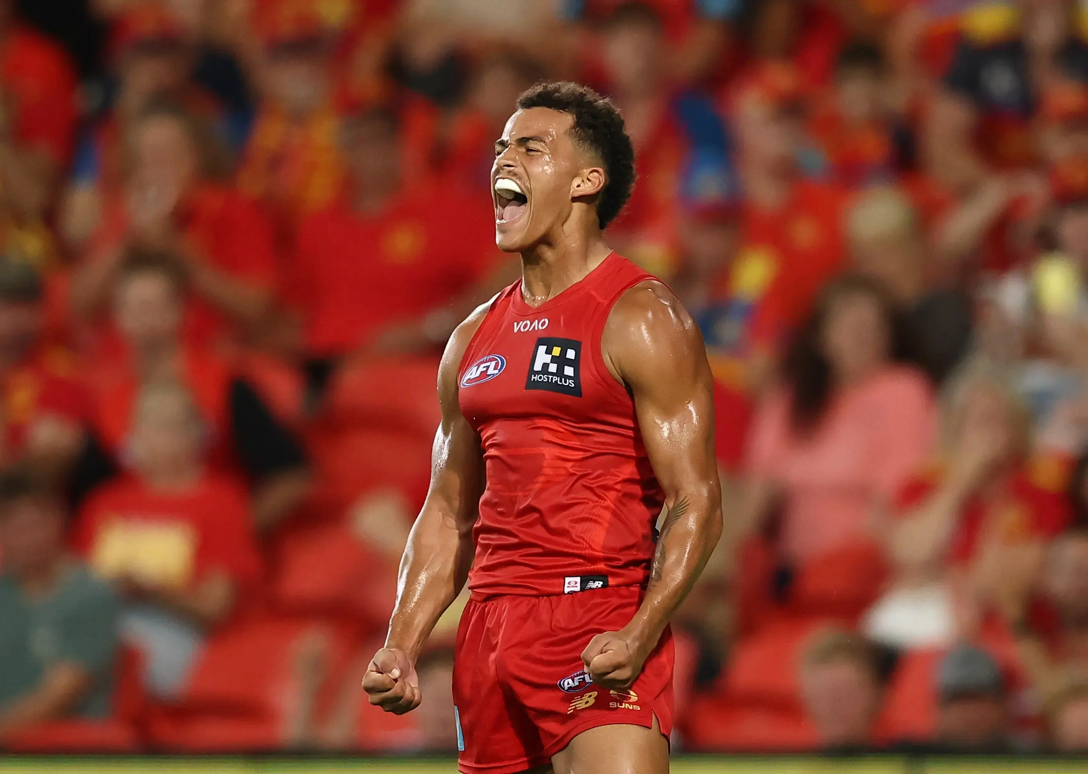 GOLD COAST, AUSTRALIA - MARCH 6: Leonardo Lombard of the Suns celebrates a goal during the 2026 AFL Opening Round match between the Gold Coast Suns and the Geelong Cats at People First Stadium on March 6, 2026 in the Gold Coast, Australia. (Photo by James Wiltshire/AFL Photos via Getty Images)
