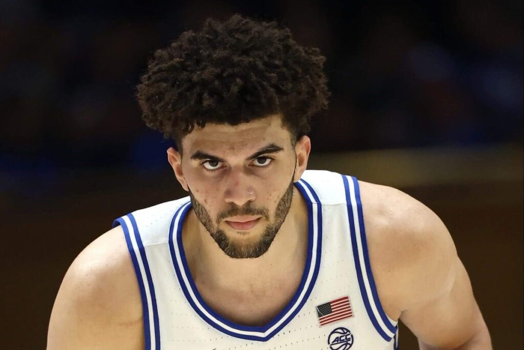 A close-up shot of a basketball player staring menacingly.