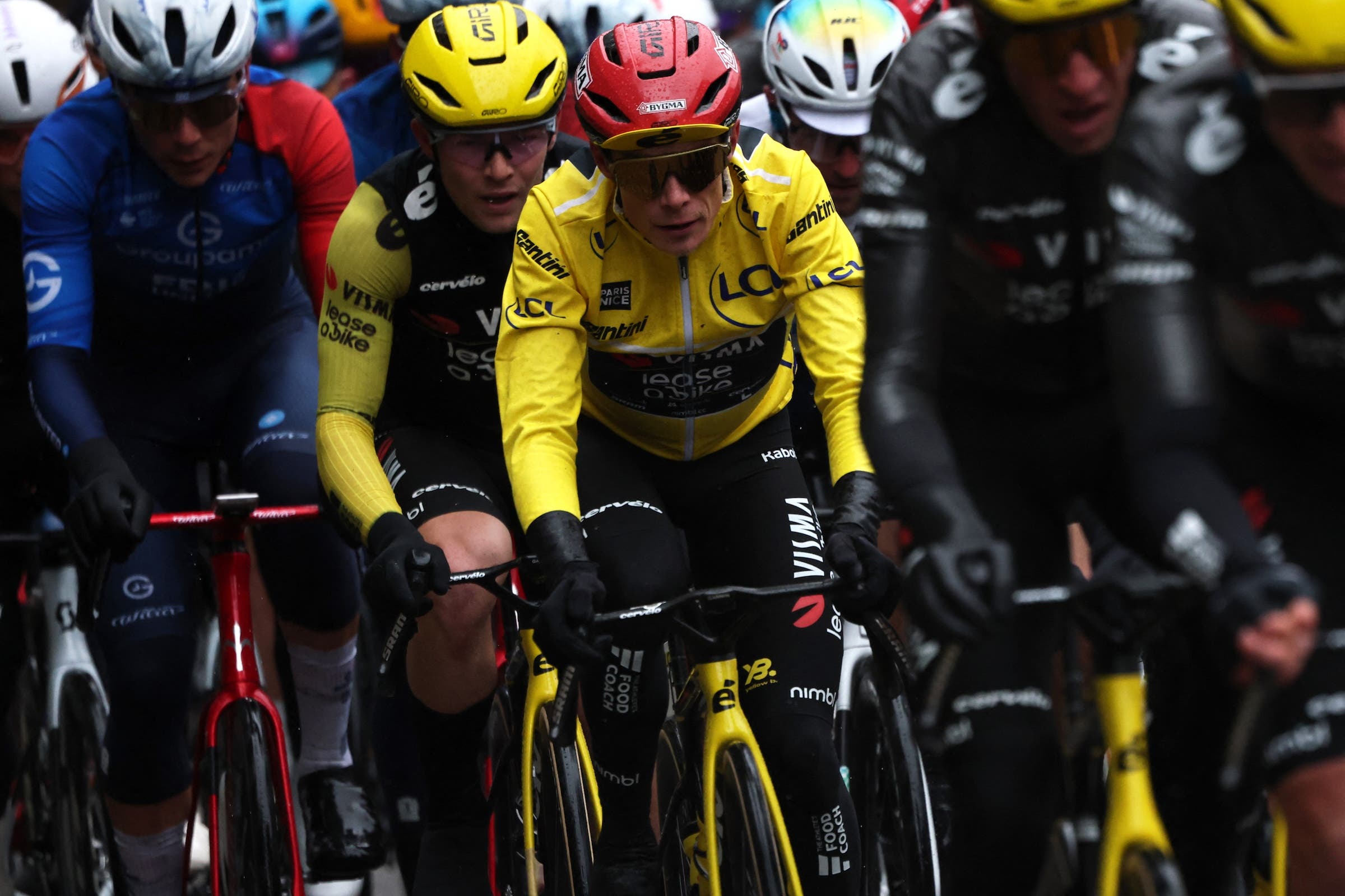 Jonas Vingegaard, wearing the overall leader yellow jersey, rides with the pack during the 7th stage of the Paris-Nice cycling race (Photo: Anne-Christine Poujoulat / AFP)