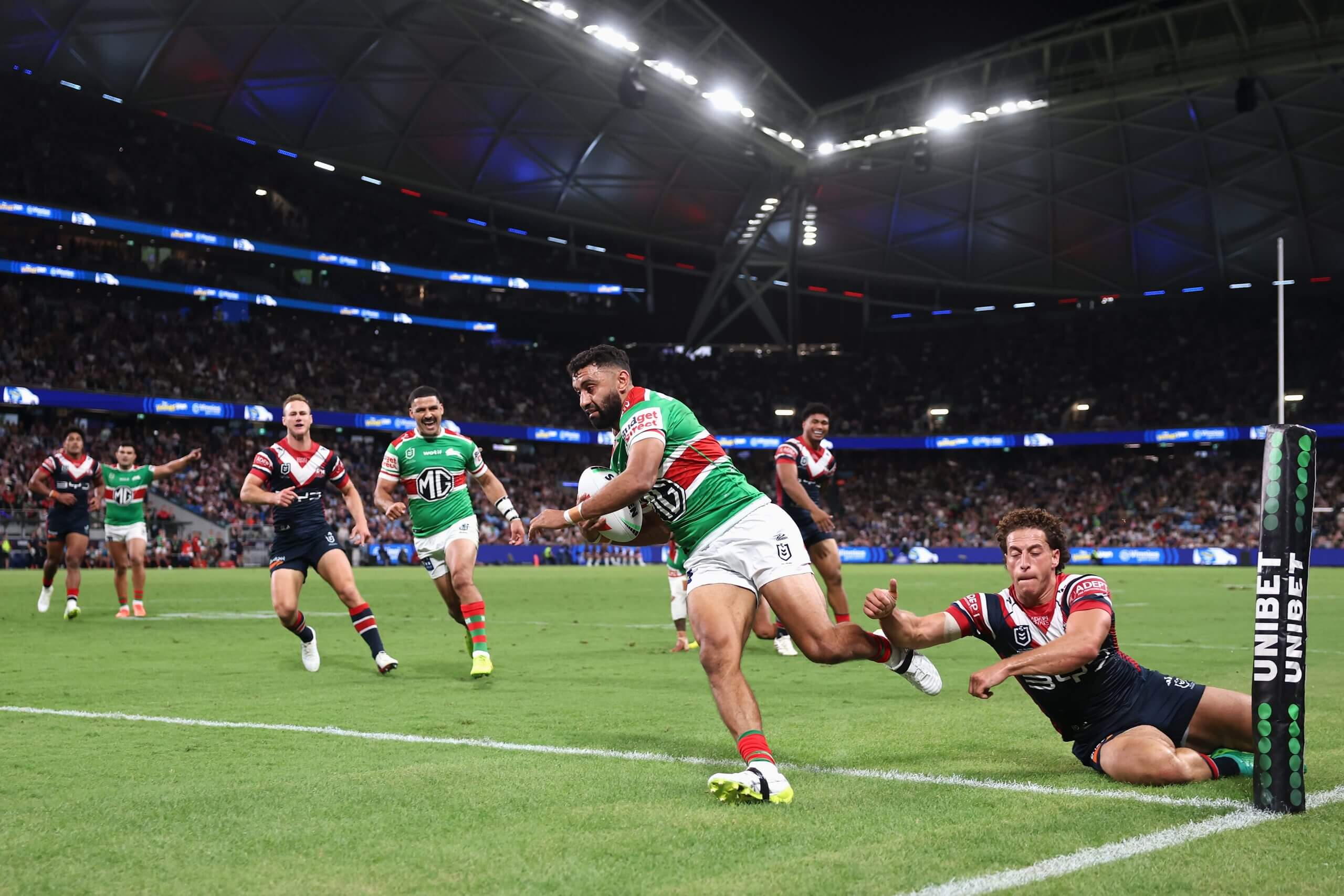 Alex Johnston sprints away to score a try in the left corner for the Rabbitohs