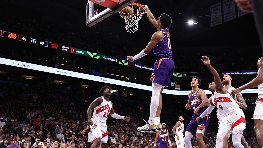 Ryan Dunn #0 of the Phoenix Suns dunks the ball during the first half against the Toronto Raptors a...