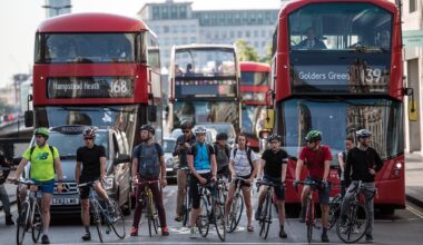 Cyclists waiting at traffic lights in London.