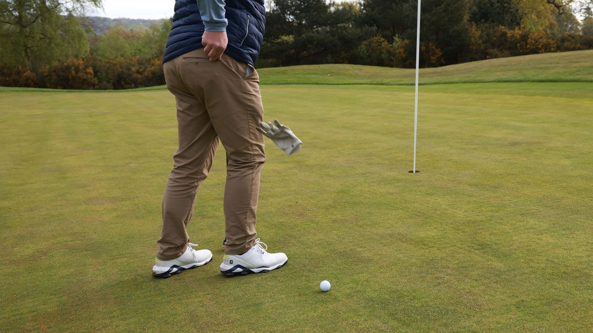 Golf glove dropped on golf ball