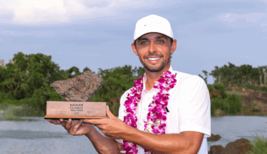 Marco Penge holds up the Hainan Classic trophy after winning in 2025
