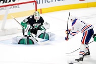 Dallas Stars goaltender Jake Oettinger (29) stops a breakaway shoot by Edmonton Oilers left...