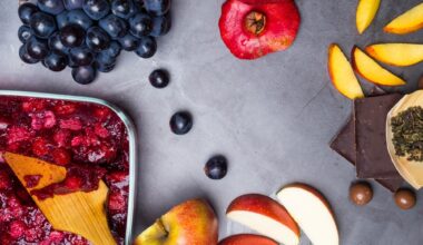 flavonoid rich food: apples, blueberries, raspberries on grey concrete