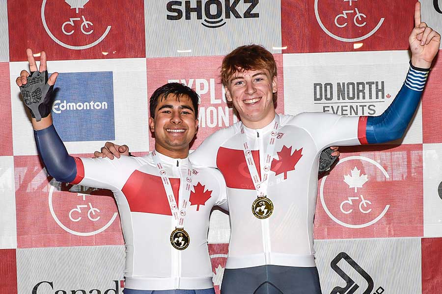 Two athletes wearing the Cycling Canada National Champion's Jersey.