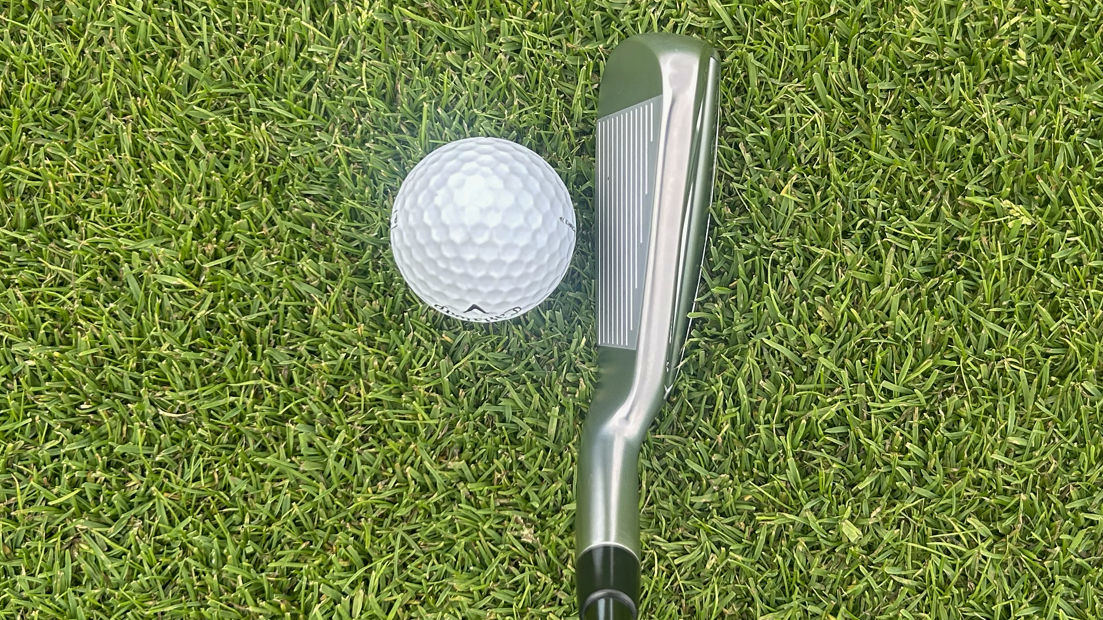 Photo of the Ping iDi Utility Iron in behind the ball