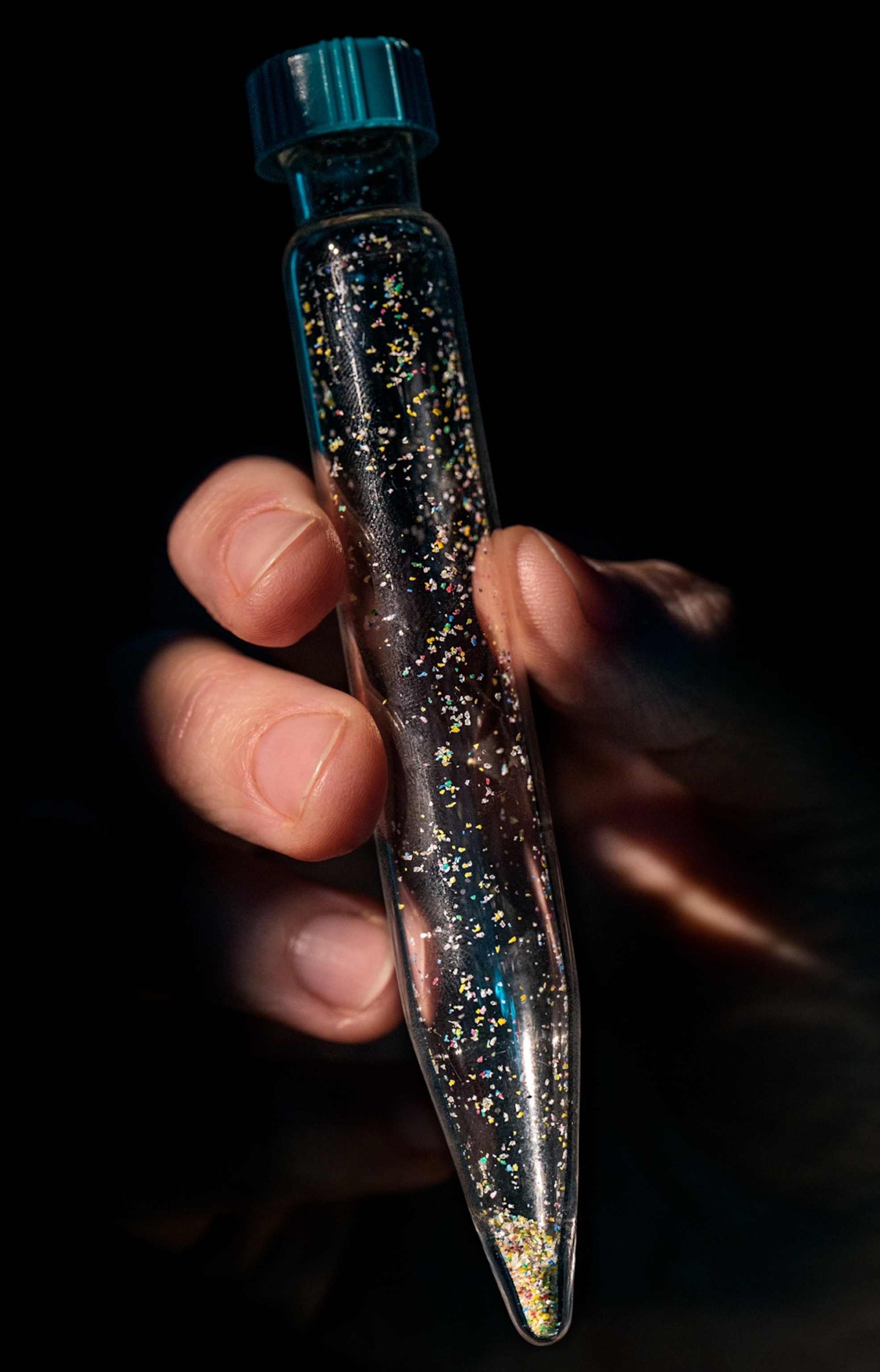 A vial of colorful granular pieces