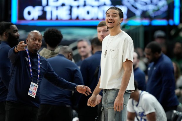 Magic guard Anthony Black smiles from the bench during the second half of Sunday's game against the Bucks in Milwaukee. (AP Photo/Aaron Gash)