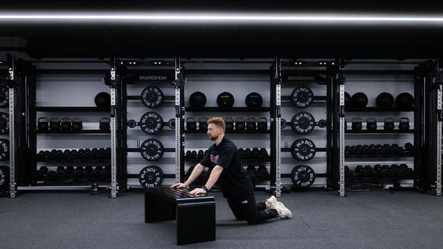 Marchon coach Patrick James demonstrating a kneeling hands-elevated press-up