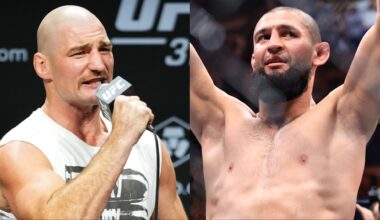 Sean Strickland speaks during the UFC 312 press conference, opposite Khamzat Chimaev celebrating his win at UFC 319