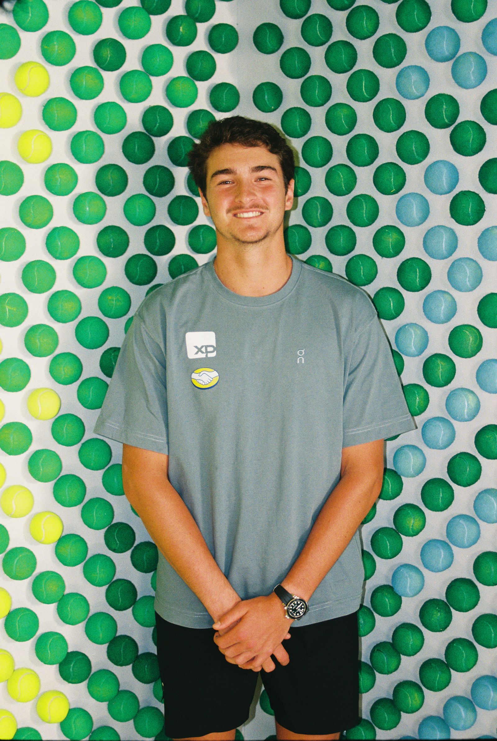 Image may contain Mikel Iglesias Clothing Sleeve Person Teen Face Head TShirt Happy Smile and Photography