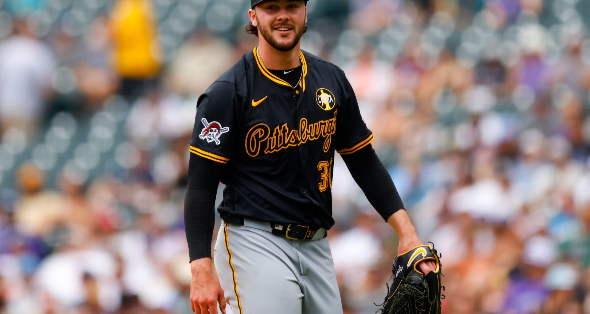 DENVER, CO - AUGUST 2: Starting pitcher Paul Skenes #30 of the Pittsburgh Pirates smiles as he walks off the field in the fourth inning against the Colorado Rockies at Coors Field on August 2, 2025 in Denver, Colorado. (Photo by Justin Edmonds/Getty Images)