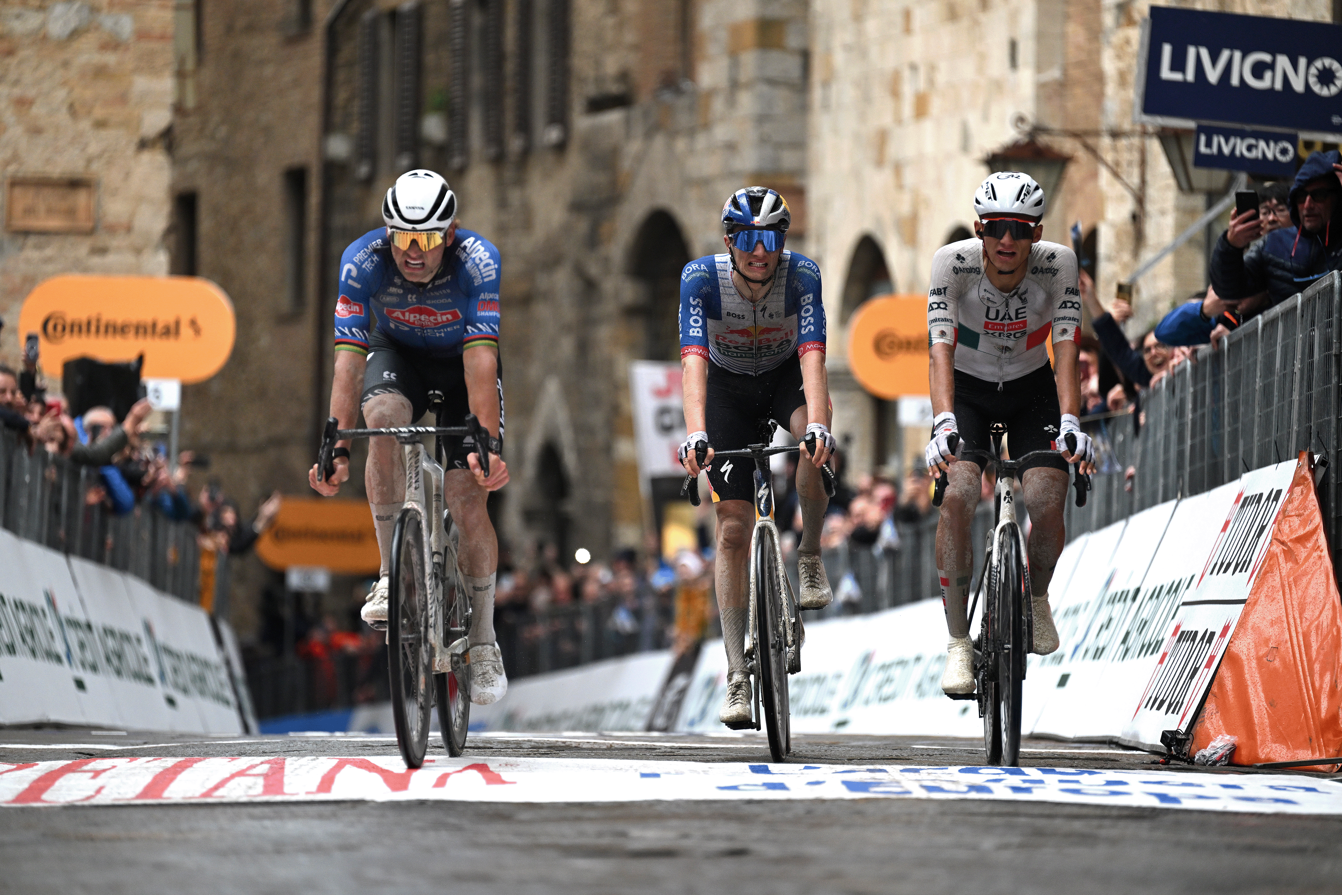 SAN GIMIGNANO, ITALY - MARCH 10: (L-R) Stage winner Mathieu van der Poel of Netherlands and Team Alpecin-Premier Tech, Giulio Pellizzari of Italy and Team Red Bull - BORA - hansgrohe and Isaac Del Toro of Mexico and UAE Team Emirates - XRG cross the finish line during the 61st Tirreno-Adriatico 2026, Stage 2 a 206km stage from Camaiore to San Gimignano 332m / #UCIWT / on March 10, 2026 in San Gimignano, Italy. (Photo by Tim de Waele/Getty Images)